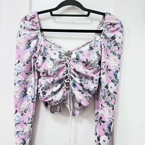 ASOS design petite long sleeve top with lace up front in floral print.